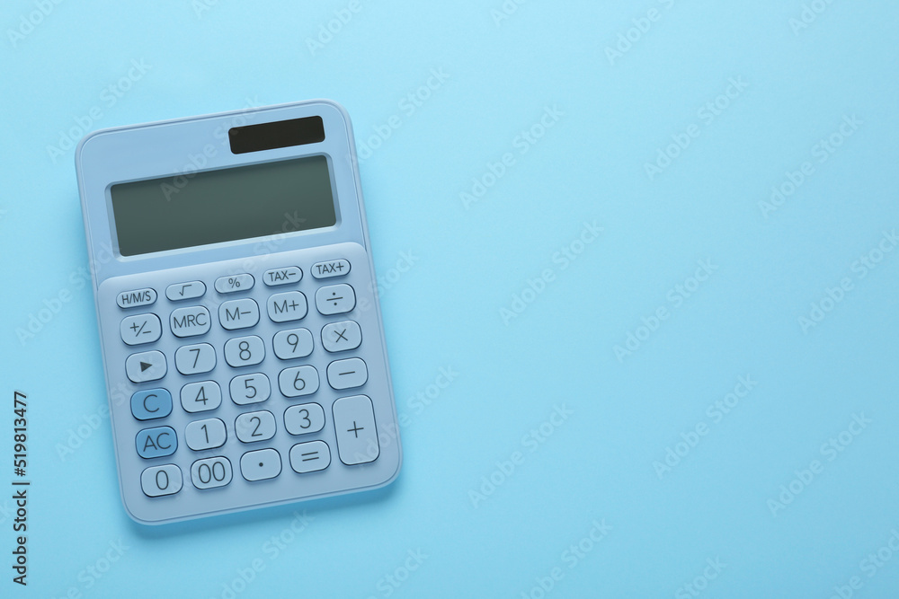 Modern calculator on light blue background, top view. Space for text Modern calculator on light blue background, top view. Space for text