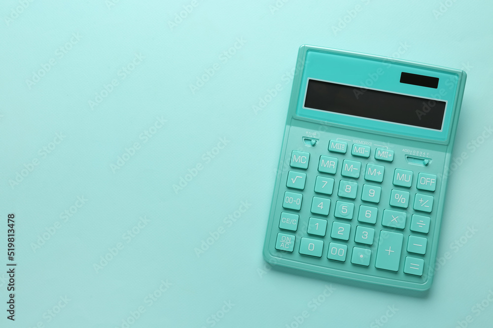 Turquoise calculator on light blue background, top view. Space for text Turquoise calculator on light blue background, top view. Space for text