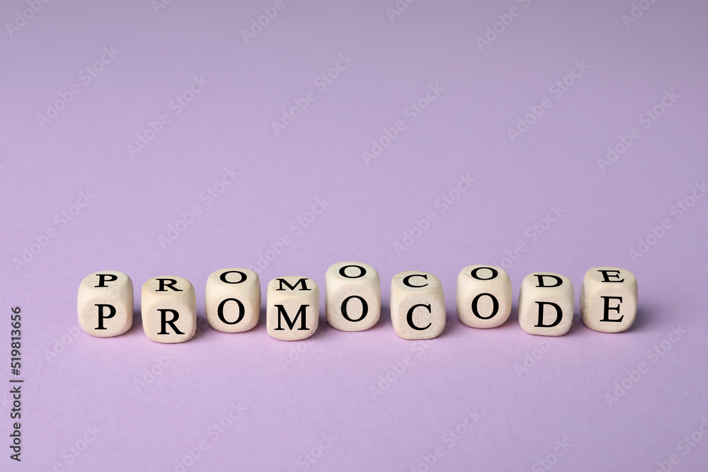 Wooden cubes with words Promo Code on violet background Wooden cubes with words Promo Code on violet background