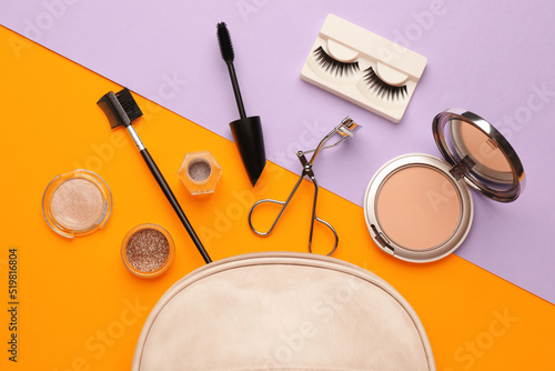Flat lay composition with eyelash curler, makeup products and accessories on color background