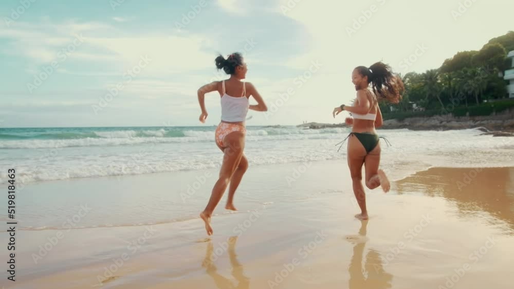 Two attractive women friends in Bikini enjoying and relaxing on the beach, Summer, vacation, holidays, Lifestyles concept.. Two attractive women friends in Bikini enjoying and relaxing on the beach, Summer, vacation, holidays, Lifestyles concept..