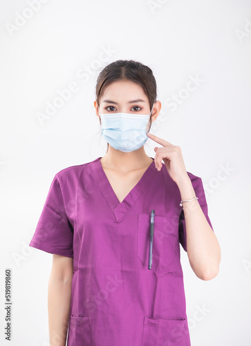A female nurse in a purple uniform