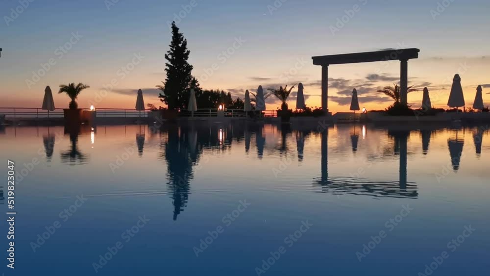 Beautiful sunset over the empty pool and the sea. The Aegean sea. Turkey, Kusadasi. Beautiful sunset over the empty pool and the sea. The Aegean sea. Turkey, Kusadasi.