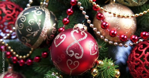 horizontal panning of christmas tree. red and gold christmas balls