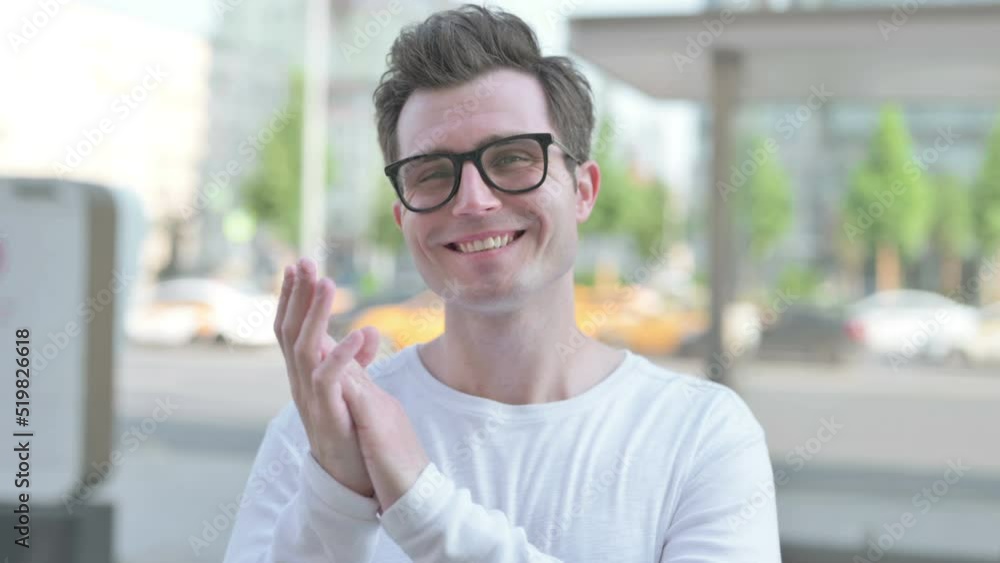 Young Man Clapping in Appreciation Outdoor Young Man Clapping in Appreciation Outdoor