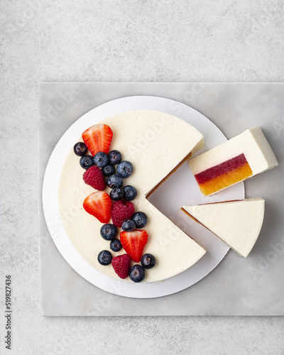 Berry mousse cake Decorated with berries. White background.