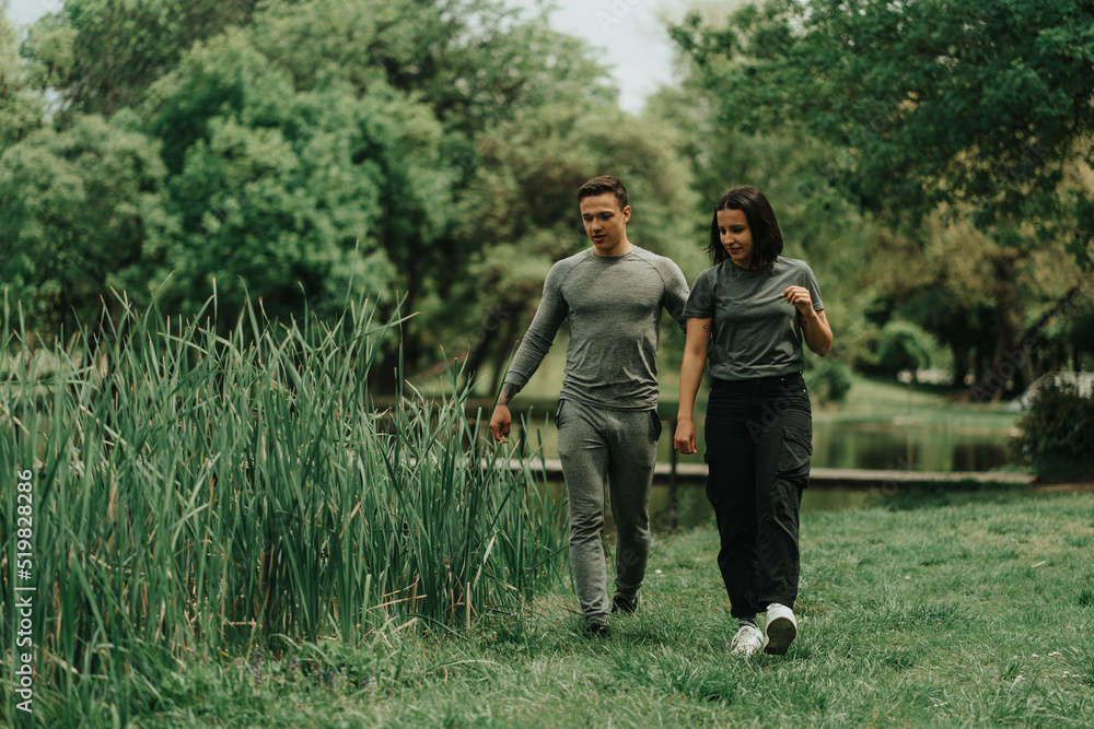 Close up of couple walking in the park Close up of couple walking in the park