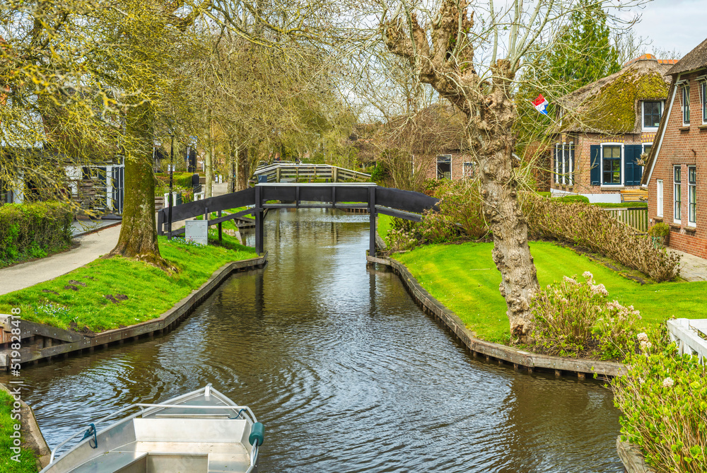 Fototapeta premium Wooden bridges over the canal in Giethoorn village, Netherlands