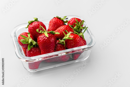 Obraz na płótnie Glass box with fresh strawberries. Vegetables in a glass containers. Food storage concept w salonie
