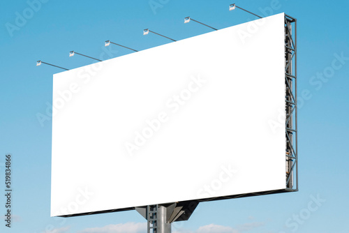 Large white blank billboard for outdoor advertisement, information board on blue sky background