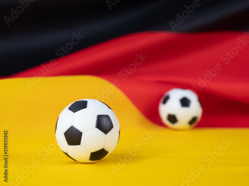 Soccer ball on the German flag. The ball against the background of the German flag.