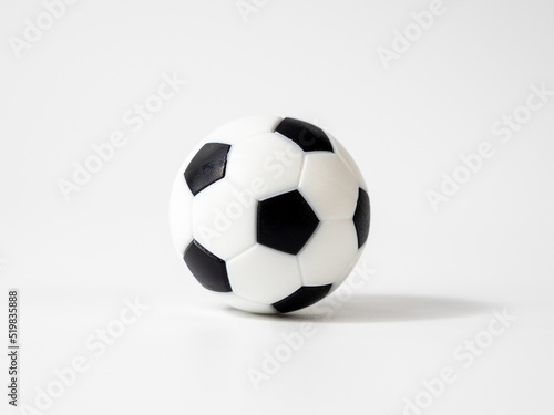 Soccer ball on a white background. Soccer ball close up. Small soccer plastic ball.