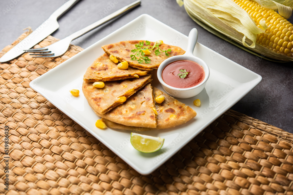 Sweet corn stuffed paratha or parotha served in a plate, Indian