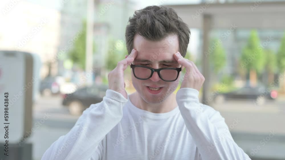 Portrait of Tense Young Man with Headache Outdoor Portrait of Tense Young Man with Headache Outdoor