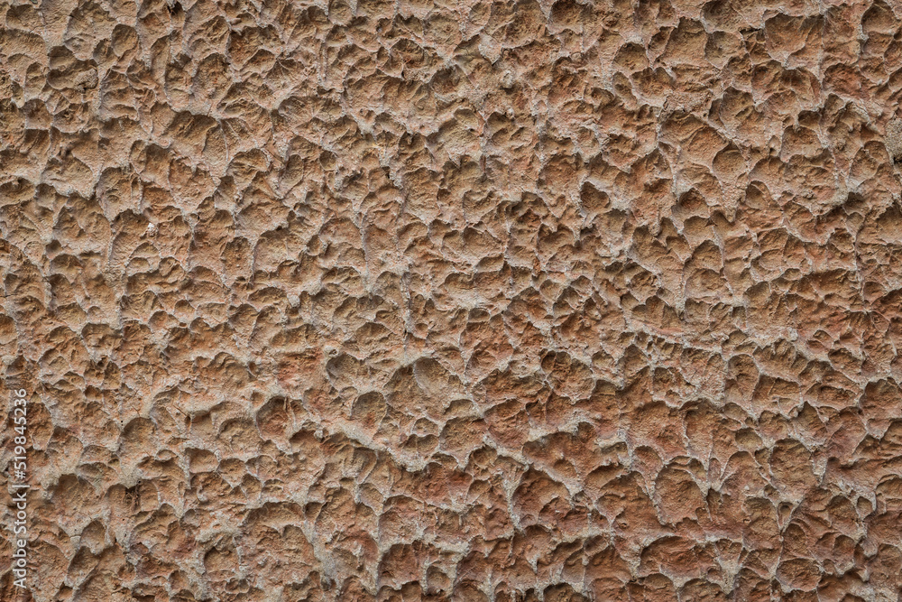 Background image of an old stucco wall that is very well aged and weathered. Background image of an old stucco wall that is very well aged and weathered.