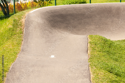 Skateboard park for skateboards, rollers and bicycles with many slopes and bends in a modern city park