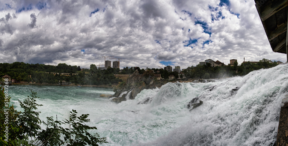 Large panorama of the Rhine Falls with little water in Switzerland
