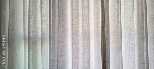 white linen curtain in apartment with sunset view in Brazil