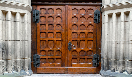 Large medieval church door with metal handle