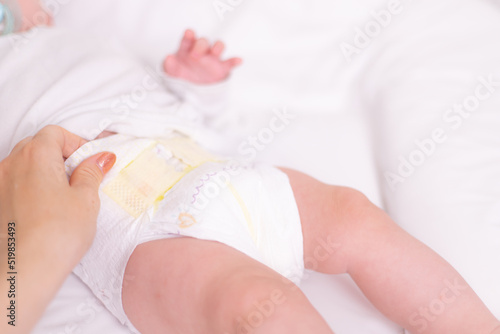 Changing the baby 's diaper . Choosing a diaper. Babies are allergic to diapers.