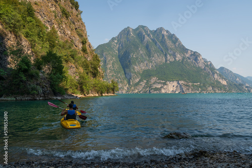 Nice panorama of the iseo lake and two people rowing in the lake, Baia del Bogn, Bergamo,Italy