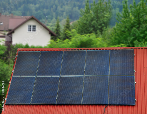 photovoltaics solar panel on home roof © Dariusz