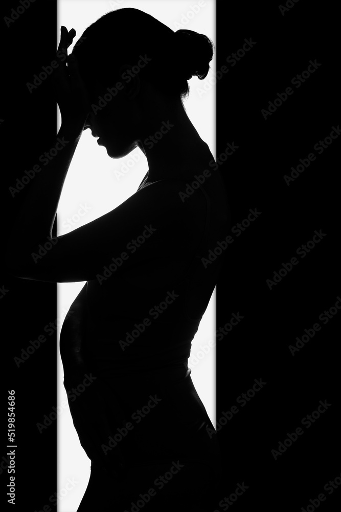 Young woman on a white background. Black and white silhouette of a female body. Female silhouette.