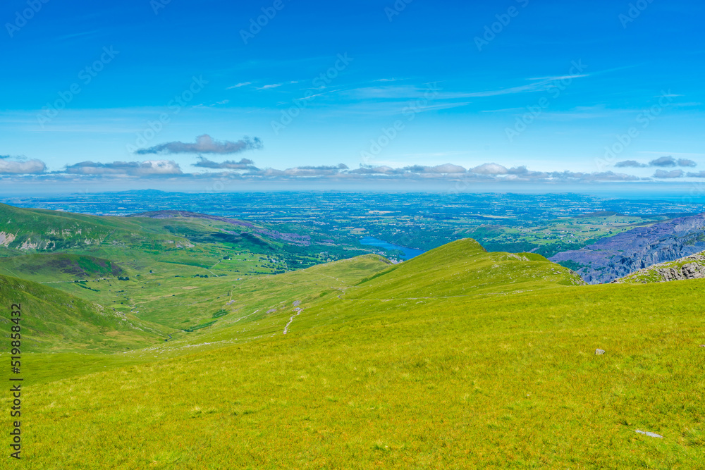 Fototapeta premium A scenic view from Mount Snowdon on a bright sunny day, Wales
