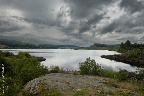 Loch Doon in Carrick Scotland on a summer but cloudy and grey day. Many tourists and staycation people visit this area of natural beauty but the water is also a hydroelectric generator using a dam 