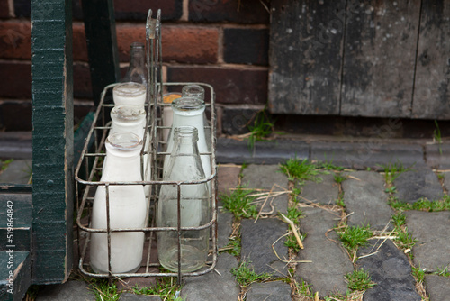 Fresh milk in recyclable glass pint bottles delivered to the door step by a traditional milk man