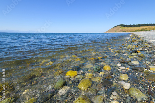 Beach and headland at Ebey's Landing with Puget Sound under a blue summer sky