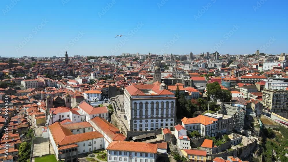 A camera drone flies away from the Episcopal Palace (former bishops' residence) and Porto Cathedral A camera drone flies away from the Episcopal Palace (former bishops' residence) and Porto Cathedral