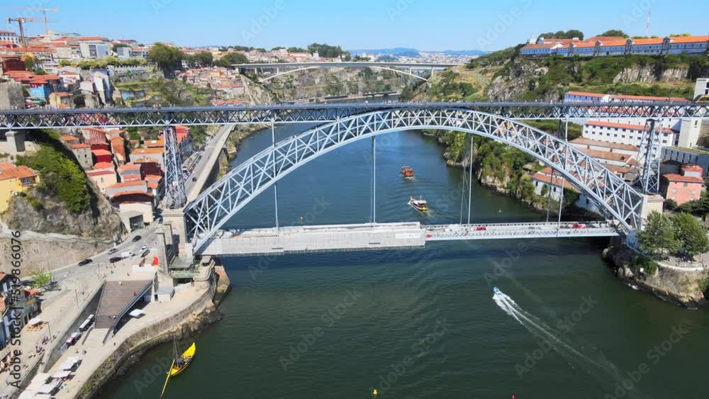 A camera drone flies sidewise over the Douro River, Porto A camera drone flies sidewise over the Douro River, Porto