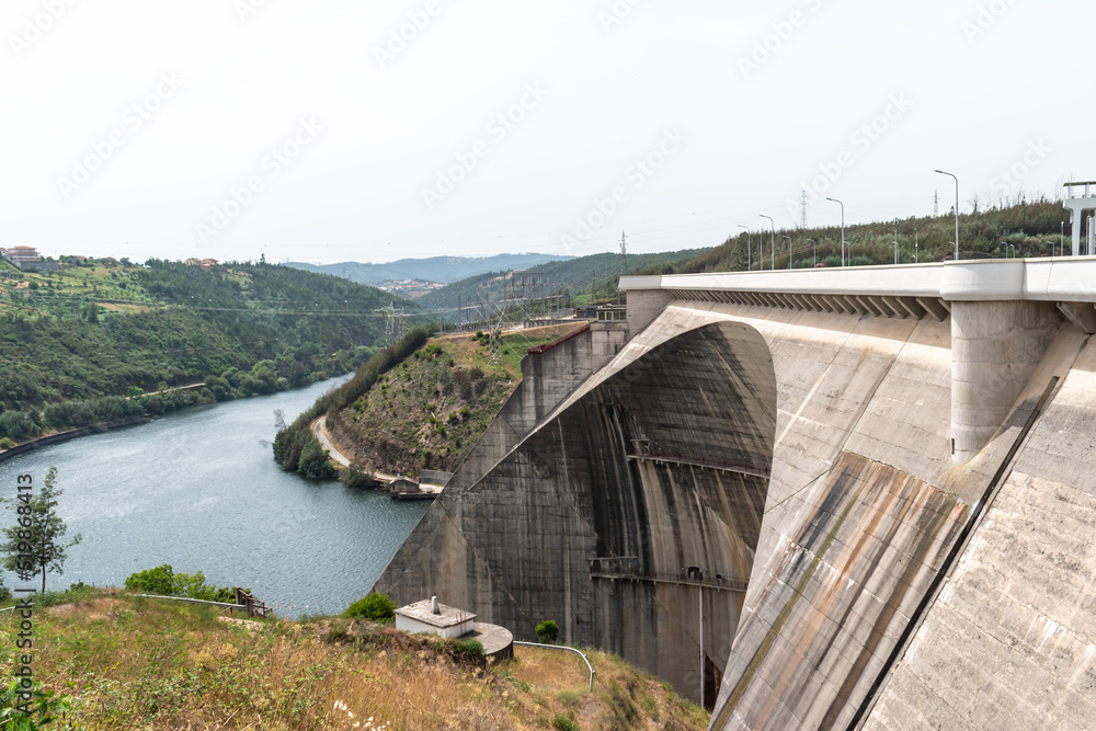 Concrete structure with arch of Aguieira dam with valley between the banks with Mondego river, Penacova PORTUGAL Concrete structure with arch of Aguieira dam with valley between the banks with Mondego river, Penacova PORTUGAL