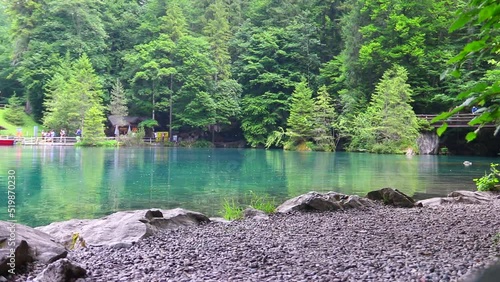 Blausee lake or Blue Lake during rain in Bernese Oberland, Kandergrund, Switzerland