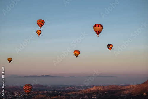 Many Hot air balloons over the Teotihuacan city in Mexico during sunrise
