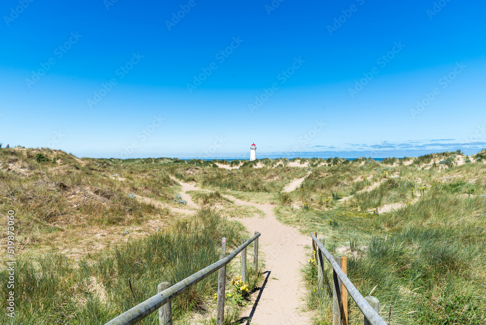 Beach in sunny day small, Talacre in Wales, view lighthouse. Beach in sunny day small, Talacre in Wales, view lighthouse.