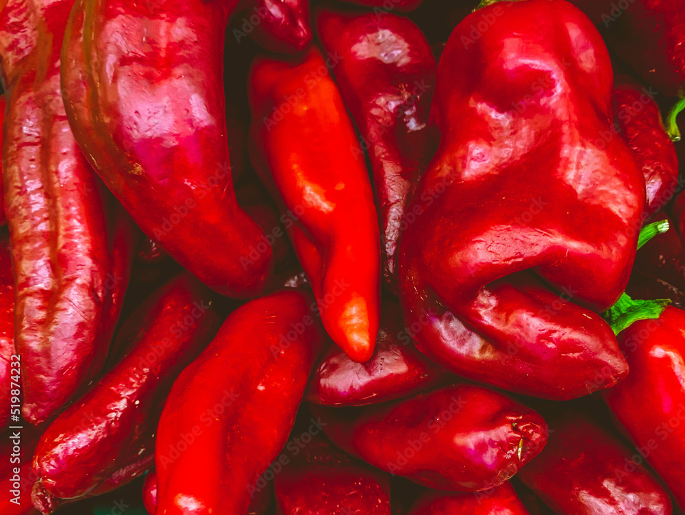 rich, sweet, red peppers, natural background. farm products. vitamin vegetables, healthy vegan foods. appetizing vegetarian food rich, sweet, red peppers, natural background. farm products. vitamin vegetables, healthy vegan foods. appetizing vegetarian food