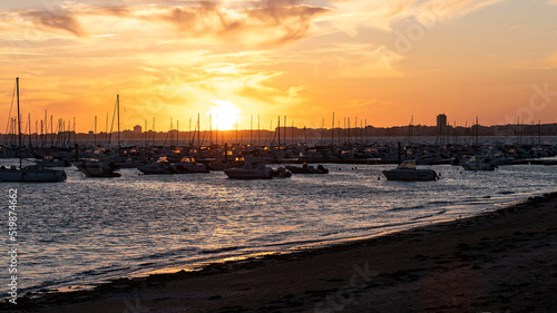 Sunset over the town, the sea and the port of Pornichet in Brittany