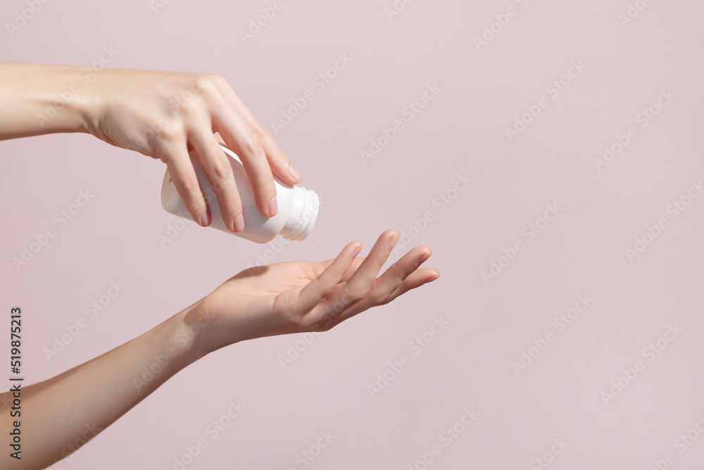 Woman holding blank white plastic tube in hands taking emergency medicine, supplements, antidepressant, painkiller medication or antibiotic. Mockup. Woman holding blank white plastic tube in hands taking emergency medicine, supplements, antidepressant, painkiller medication or antibiotic. Mockup.