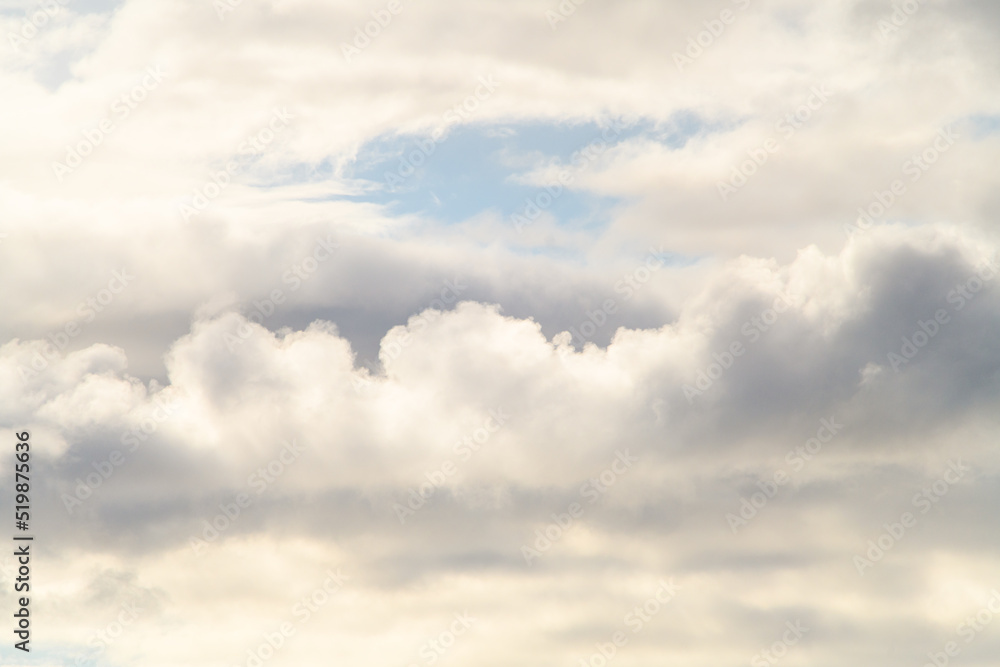 Fototapeta premium view of white and grey thick cumulus clouds on blue sky.