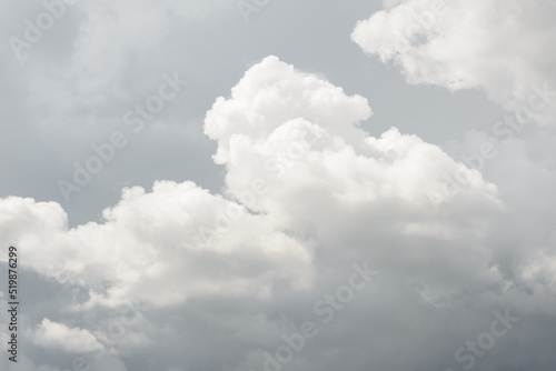 White big fluffy clouds. Natural scenic abstract background. Weather changes backdrop. Sky filled with voluminous clouds.