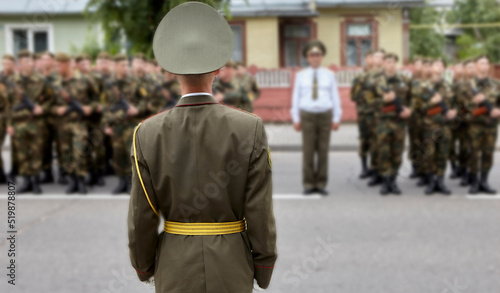 Canvas Print Soldiers in military camouflage uniforms in army formation.
