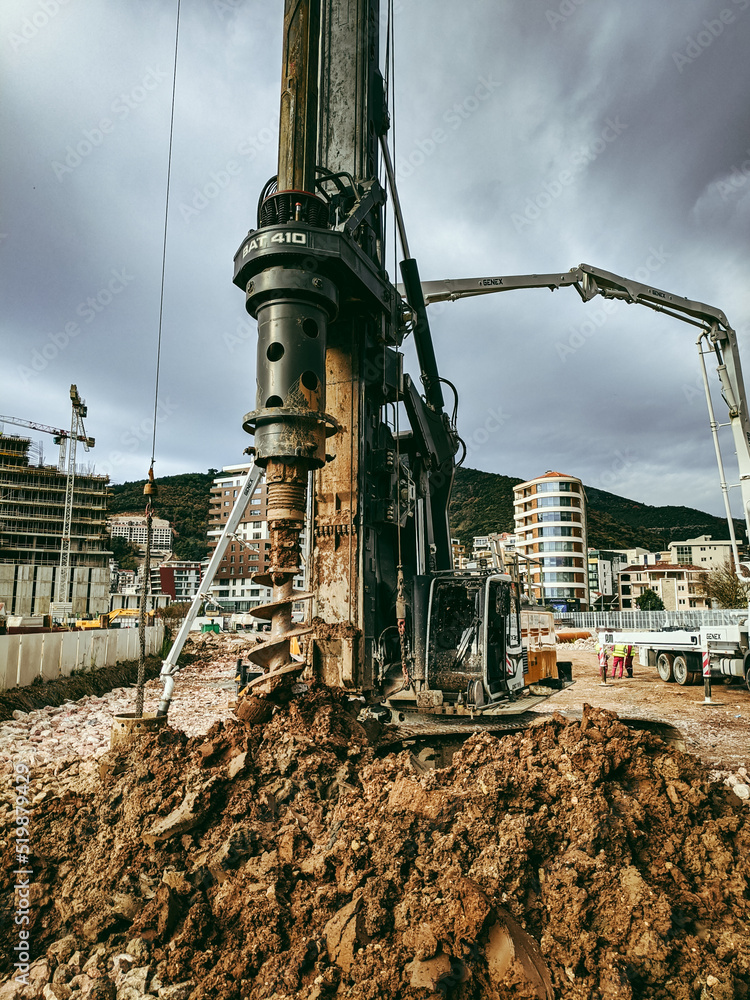 Drilling rig drills the ground at a construction site