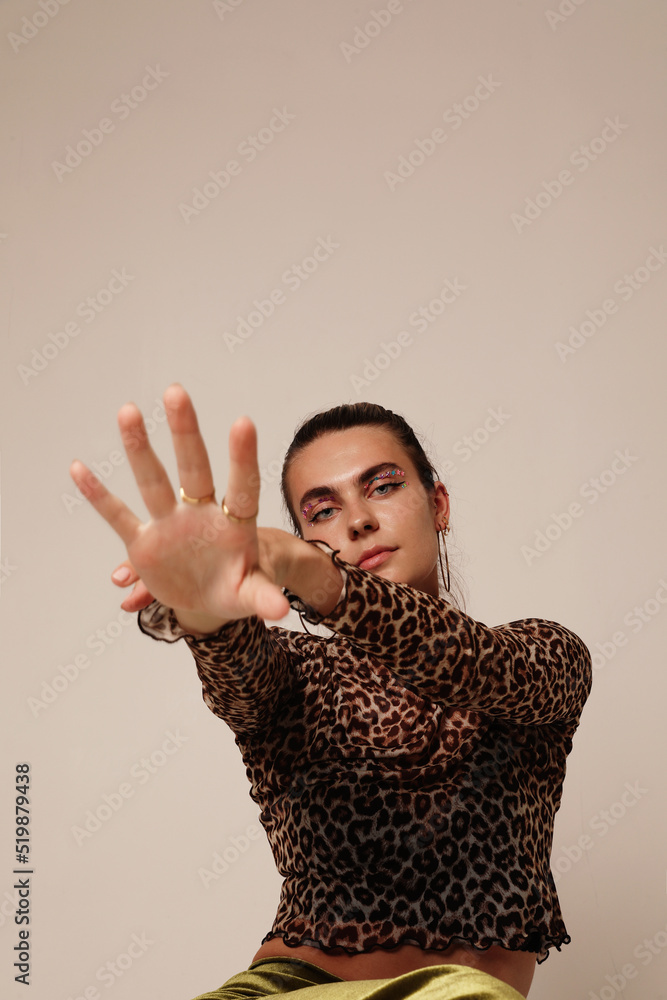 Portrait of young woman stretching her hand posing in the studio. Mock-up. Portrait of young woman stretching her hand posing in the studio. Mock-up.