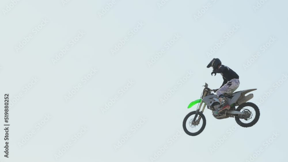 This video shows motorcross dirt biker rider flies through the sky in slow motion. This video shows motorcross dirt biker rider flies through the sky in slow motion.