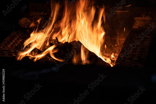 Long exposure image of a campfire burning at night.