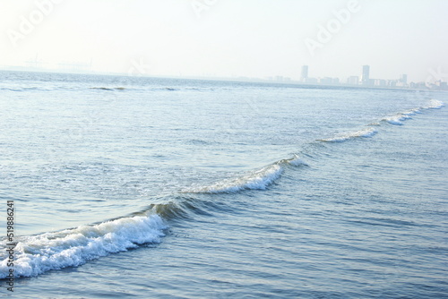 A beautiful picture of seaview wave with buildings karachi sindh. peoples of karachi.