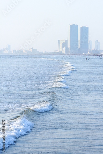 A beautiful picture of seaview wave with buildings karachi sindh. peoples of karachi.