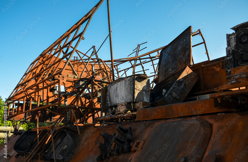 Fototapeta premium Close up of destroyed military equipment of the russian invaders. Rusty detail of a burnt combat vehicle. War in Ukraine